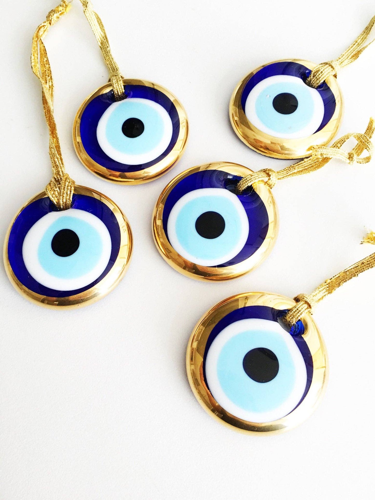 Gold trimmed glass evil eye beads with gold ropes