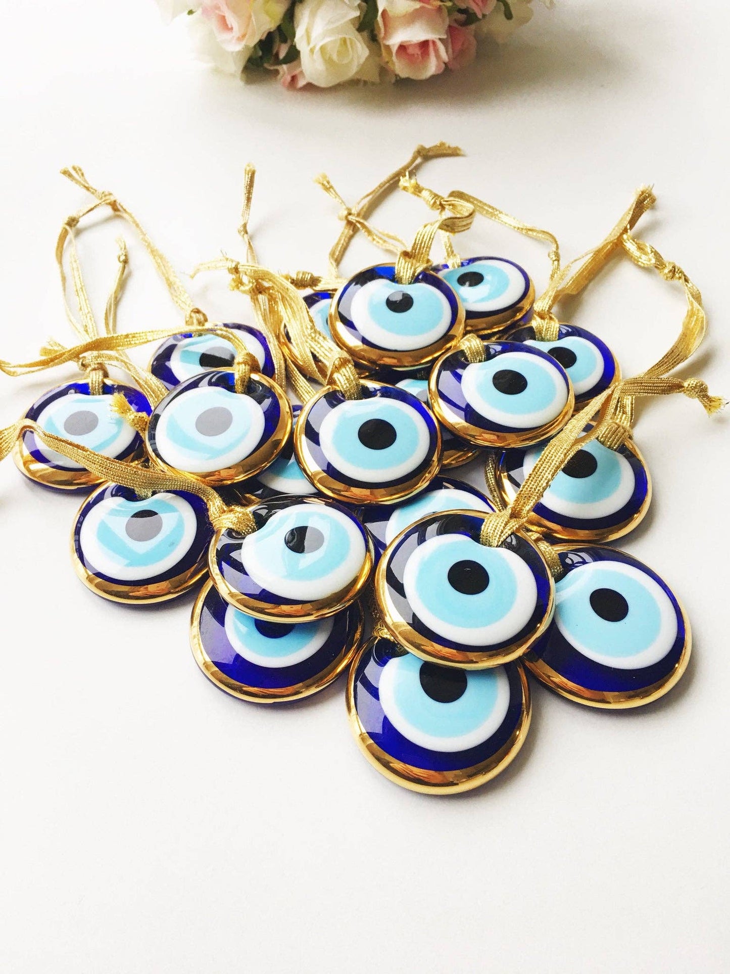 Gold trimmed glass evil eye beads with gold ropes