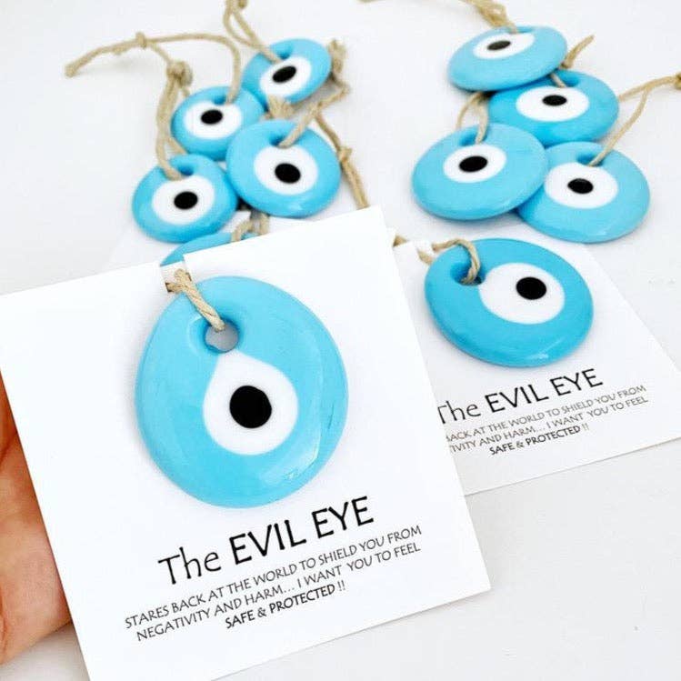 Turquoise evil eye bead with card